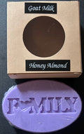 Goat milk soap bar with 'Honey Almond' scent and a visible brand name 